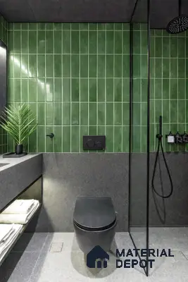 Modern bathroom with green vertical subway wall tiles and grey stone floor